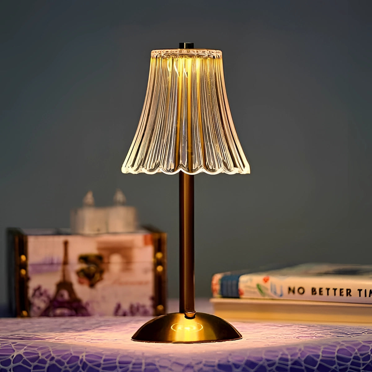 Vintage brass table lamp with a pleated shade, showcasing mid-century modern design elements, featuring a warm tints and shades aesthetic, placed on a wooden surface.