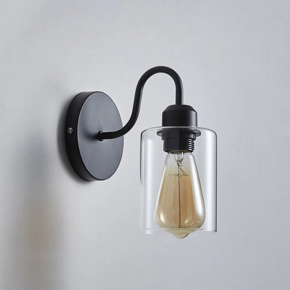 Vintage Edison bulb wall sconce featuring a black metal frame and a clear glass shade, showcasing a classic design with exposed light bulb, suitable for wall mounting in various interior settings.