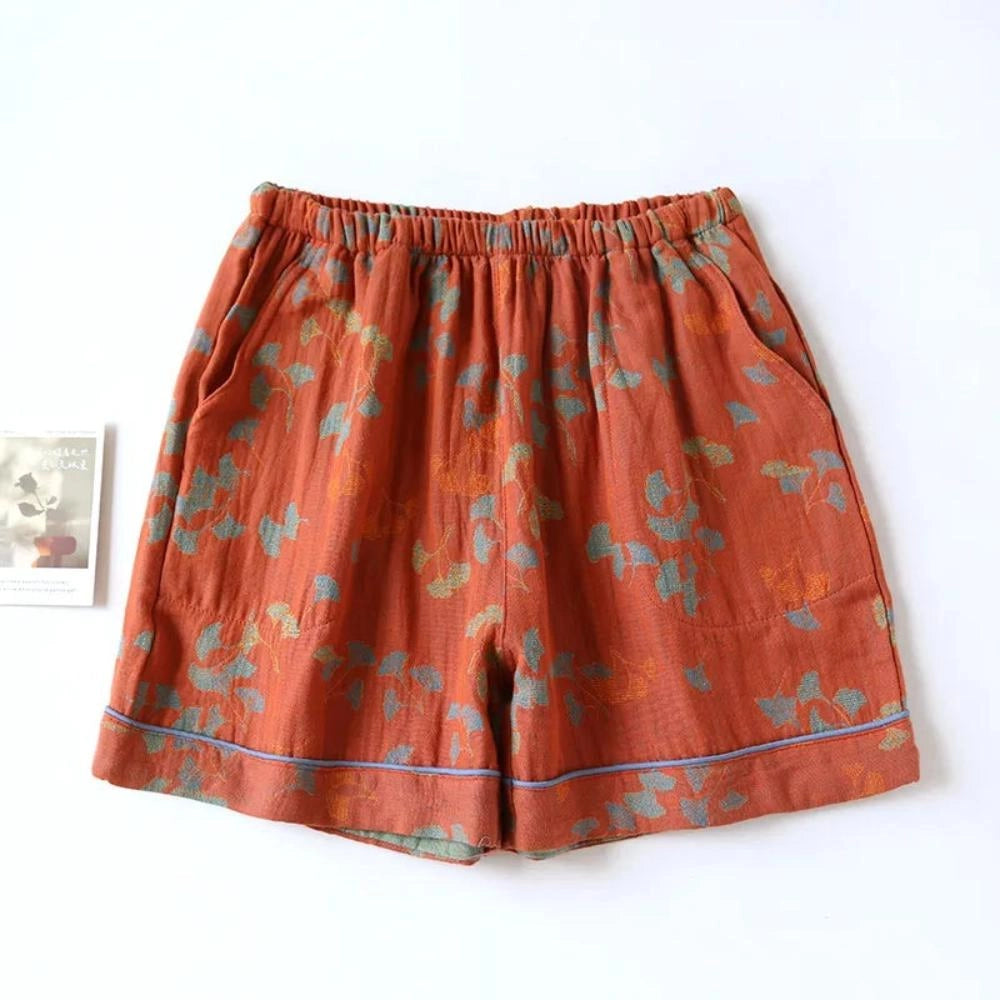 
A vintage floral bohemian midi skirt in red, featuring an elastic waist and lightweight cotton fabric, displayed in an XL size.