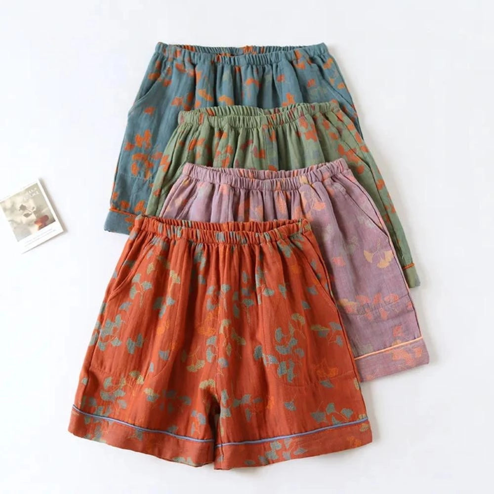 Vintage Floral Bohemian Midi Skirt in lightweight cotton fabric with an elastic waist, featuring a vibrant orange and aqua floral pattern.