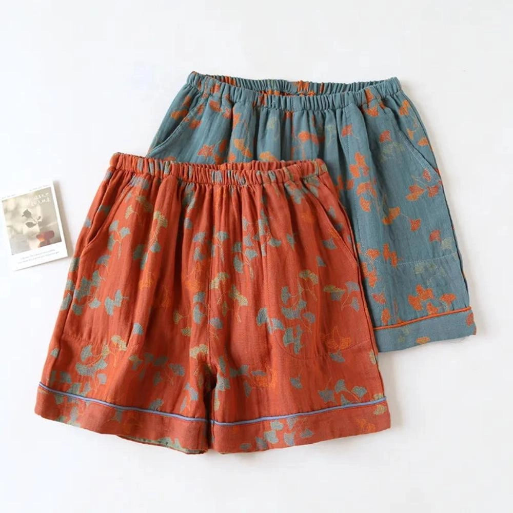 Vintage floral bohemian midi skirt in lightweight cotton with an elastic waist, featuring a vibrant orange floral pattern.
