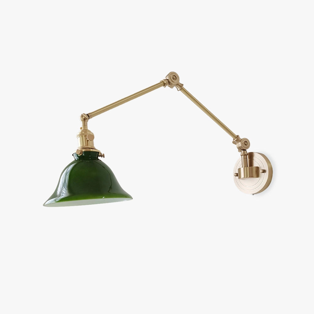 Vintage green enamel wall lamp featuring a brass arm, with a metal cone-shaped shade and circular design elements.