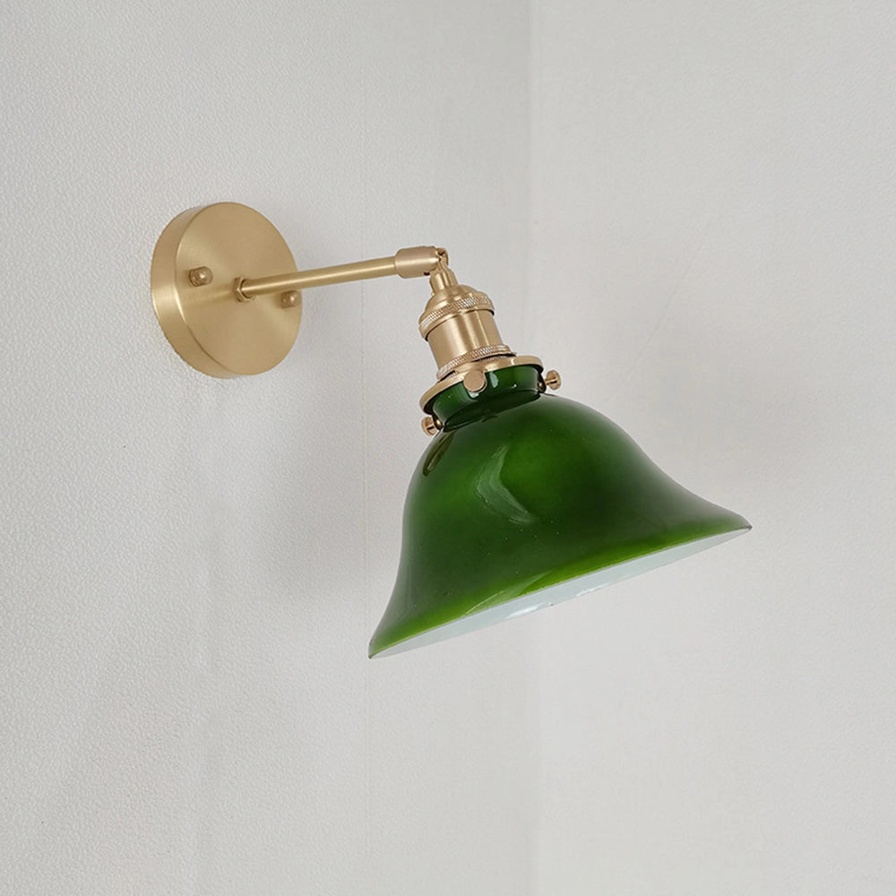 Vintage green enamel wall lamp featuring a brass arm, showcasing a classic circular design.