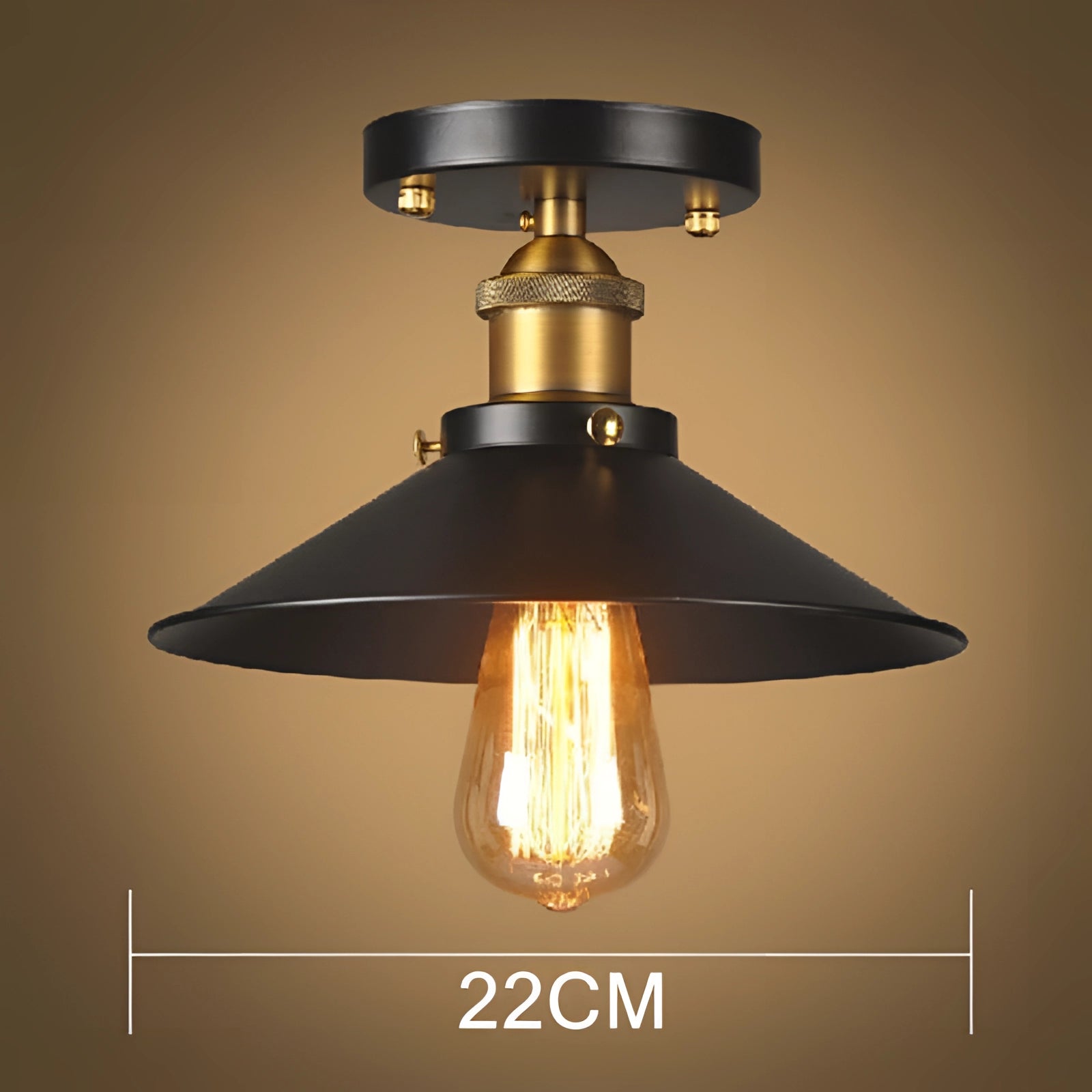 Vintage industrial ceiling light with an antique brass and black finish, featuring a metal and amber tinted design, mounted as a ceiling fixture.