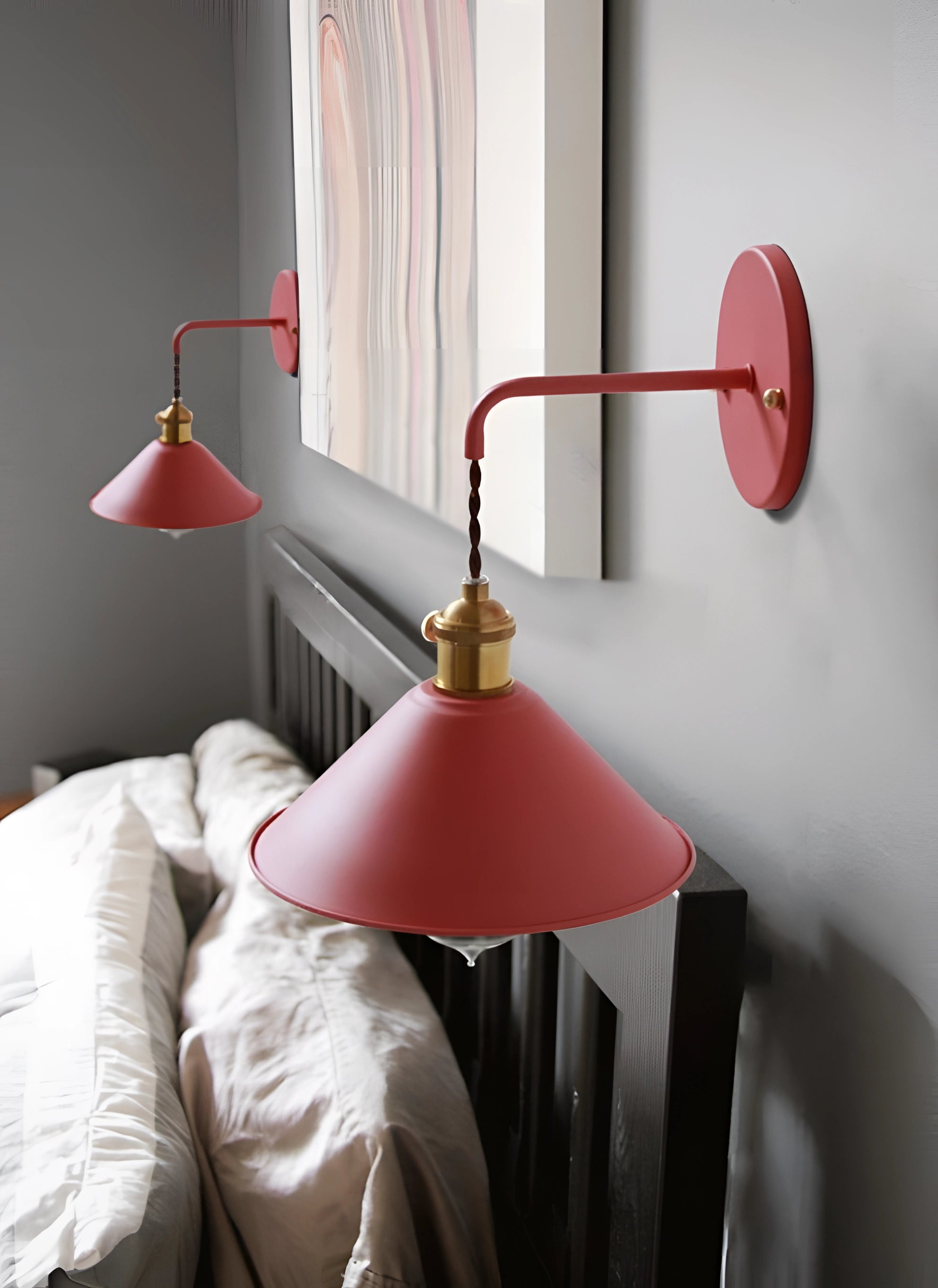 
A vintage multi-color wall lamp with an adjustable brass swing arm sconce, featuring a pink lampshade.