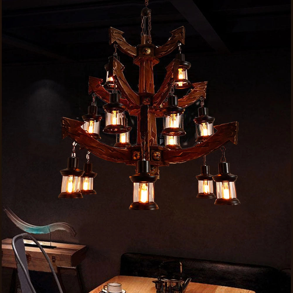 Vintage nautical ship wheel chandelier with a rustic maritime design, featuring wooden elements and symmetrical arrangement, hanging as a pendant light.