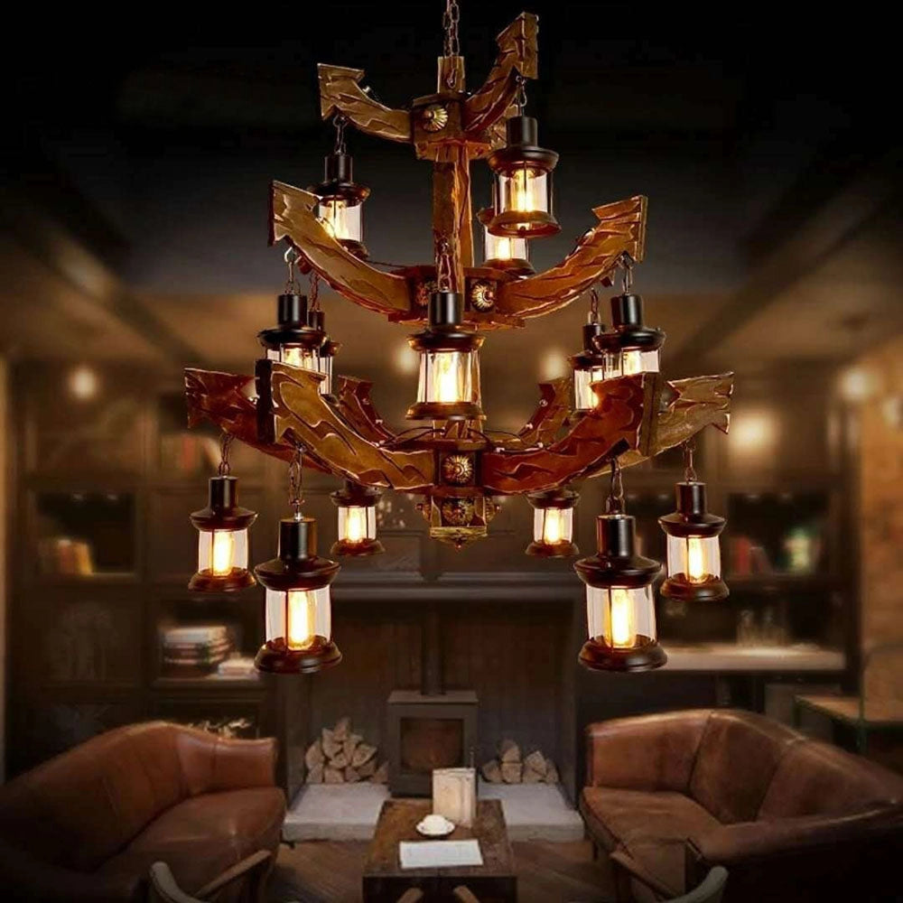 Vintage nautical ship wheel chandelier hanging from the ceiling in a rustic maritime-themed living room, featuring wooden elements and a cozy interior design with a couch and table.