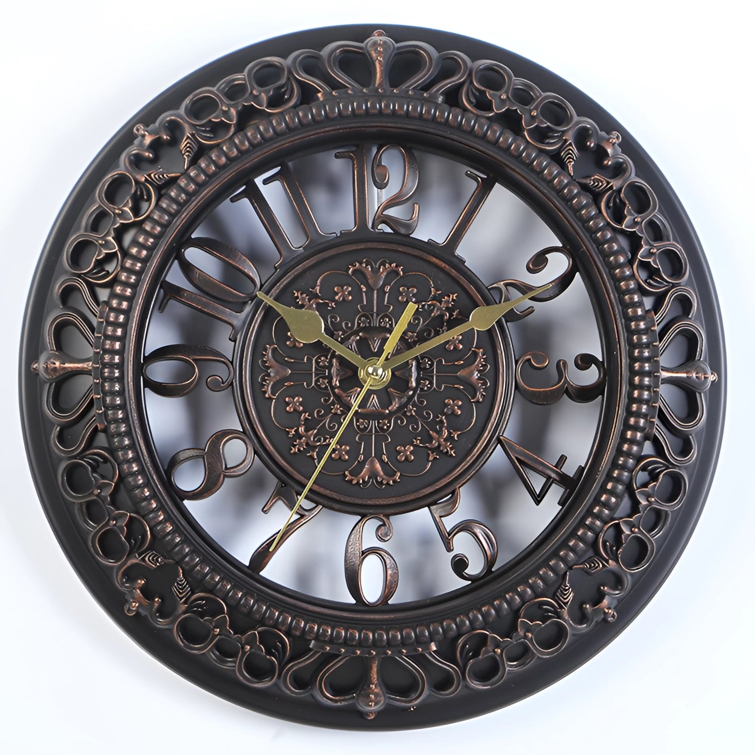 Vintage ornate white wall clock with black Roman numerals, featuring an intricate pattern on a circular metal frame and an analog quartz mechanism.