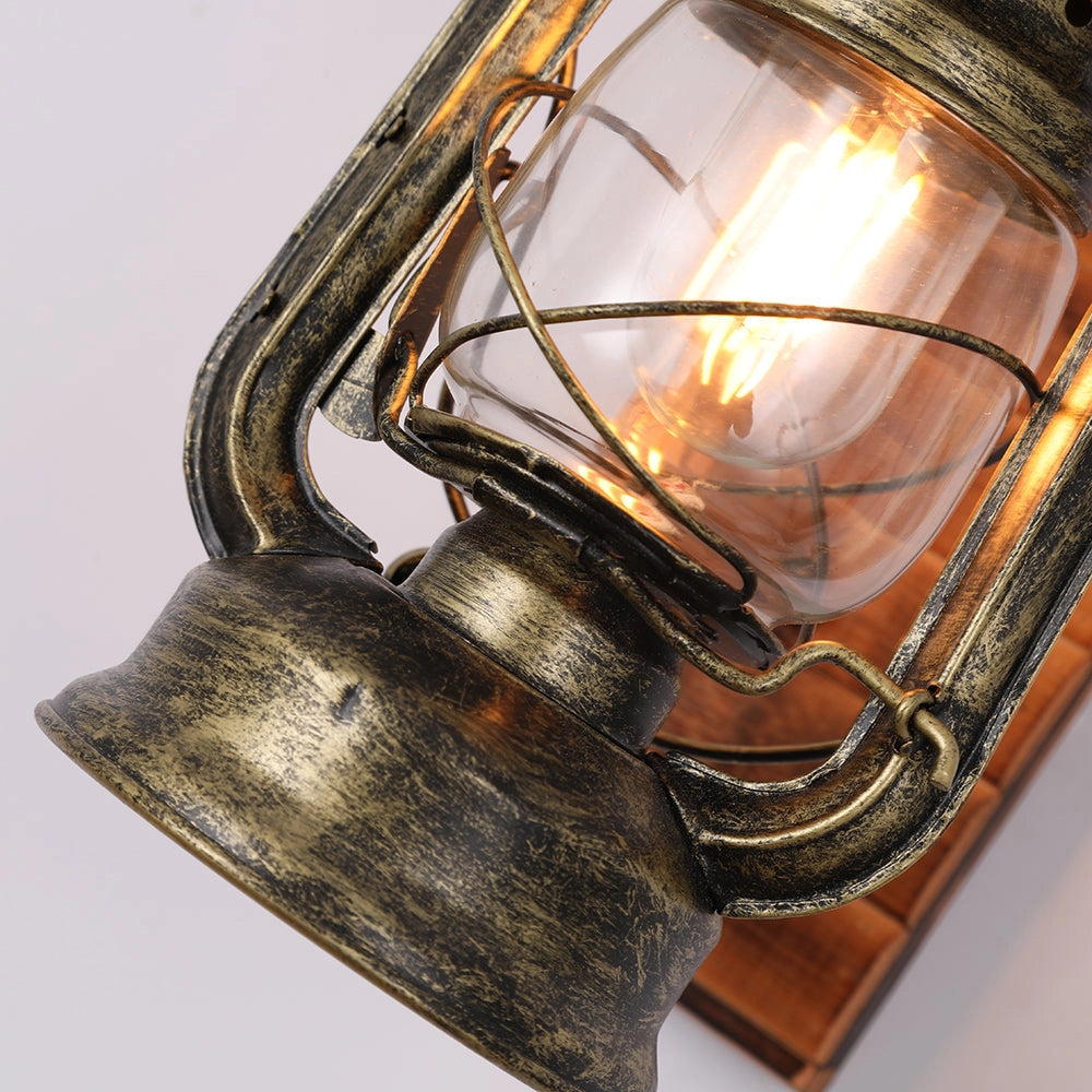 Vintage rustic lantern with an antique brass finish, featuring a rectangular shape with amber-tinted glass panels, ideal for nautical decor.