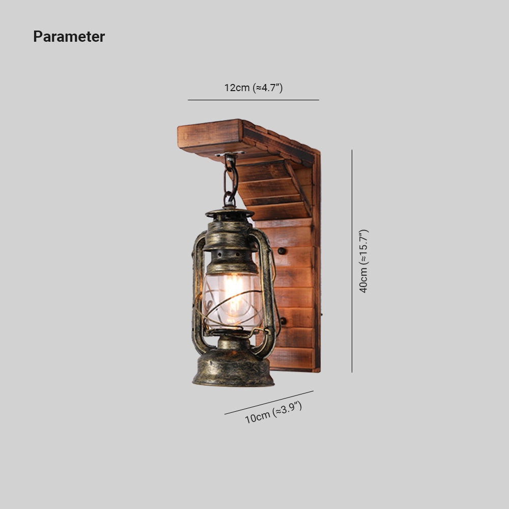 Vintage rustic lantern in antique brass finish designed as an oil lamp, ideal for nautical decor, featuring a cylindrical shape and metal structure.