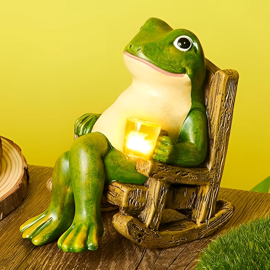 A whimsical green resin frog candle holder, perfect for patio and indoor décor, shown with lifelike details and grassy background.