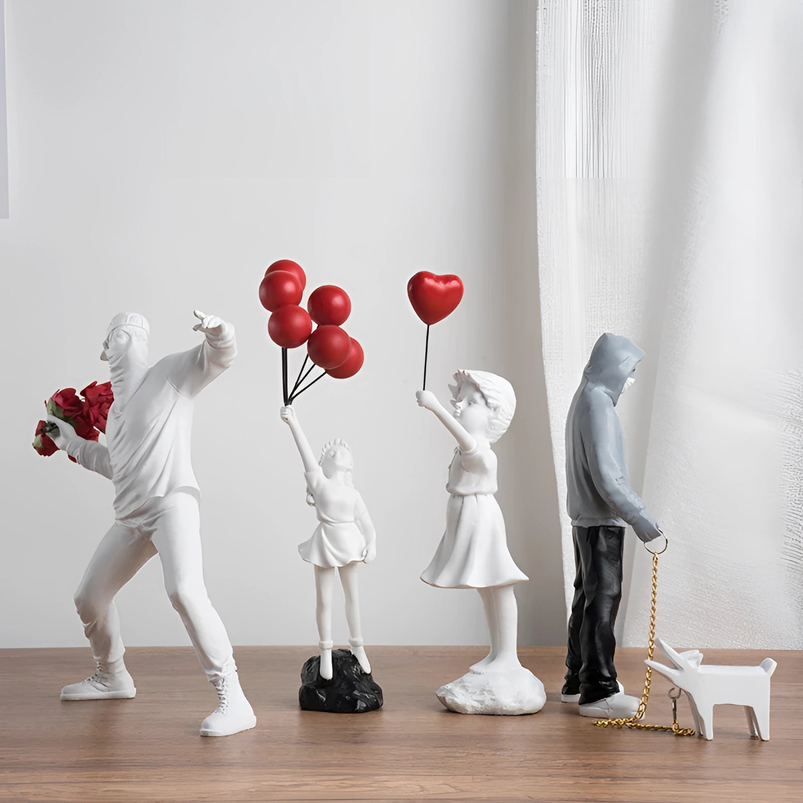 A person wearing a white morphsuit adorned with a prominent red rose, designed as a unique full-body performance costume. The suit is modeled in an interior setting, likely staged for an event or performing arts display, showcasing its fashion design and artistic flair.