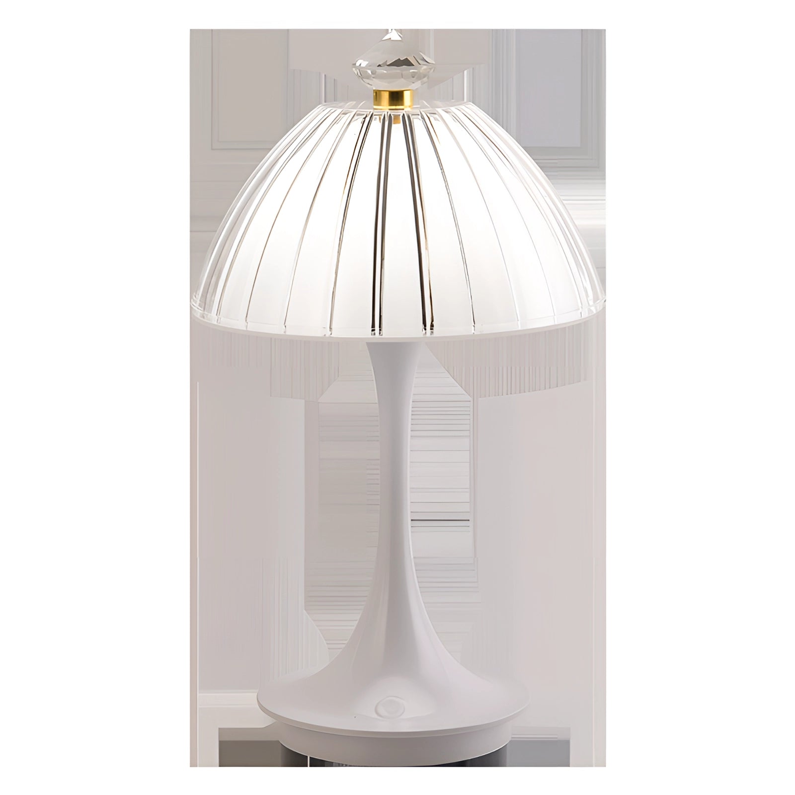 A modern white table lamp with a ribbed shade and gold accent, designed for contemporary decor, placed on a wooden table.