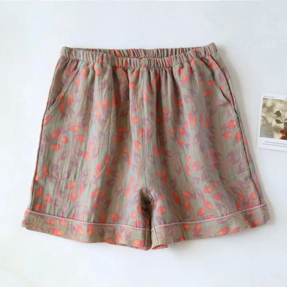 Light green women's floral print lightweight shorts with an elastic waistband, designed for a casual style in size XL.