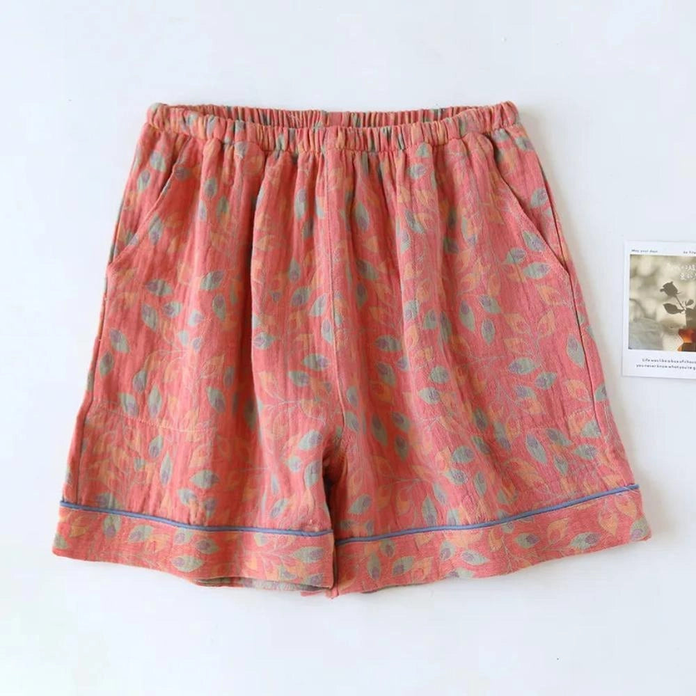 Women's pink floral print lightweight shorts in size XL with an elastic waist and casual style, featuring pockets.