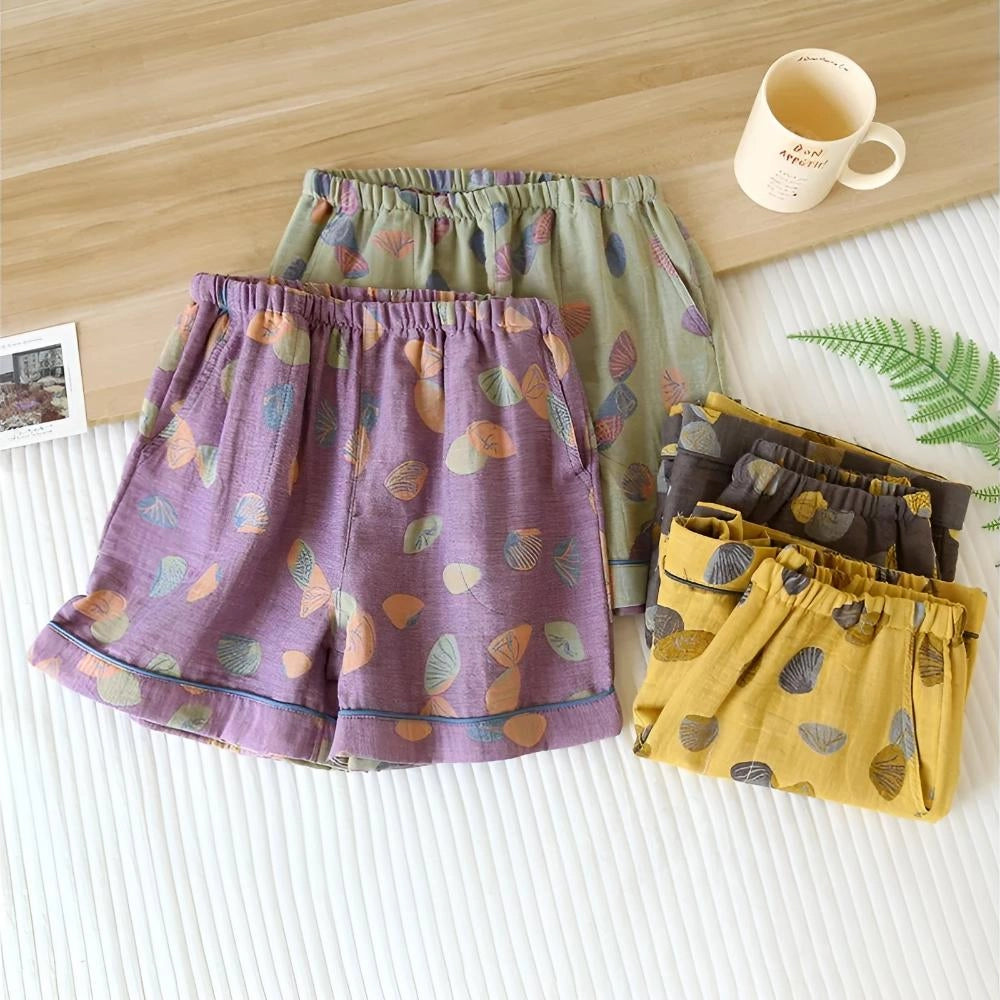 Colorful leaf print women's summer shorts with an elastic waistband, featuring vibrant and breathable fabric.