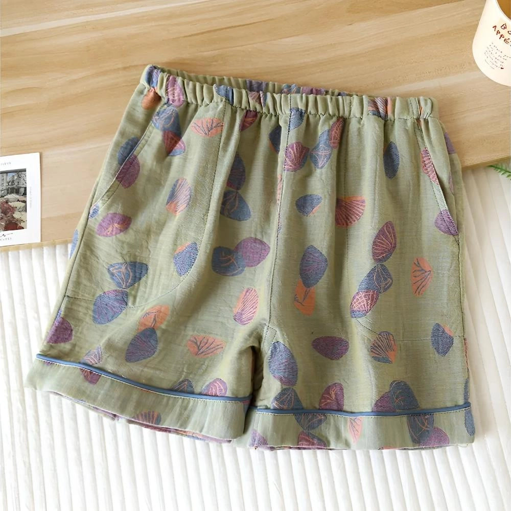 Women's green leaf print summer shorts with an elastic waist, showcasing a colorful and breathable design.