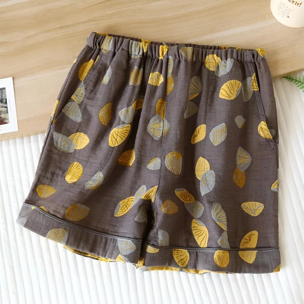Women's XL brown elastic waist summer shorts featuring a colorful leaf print pattern.