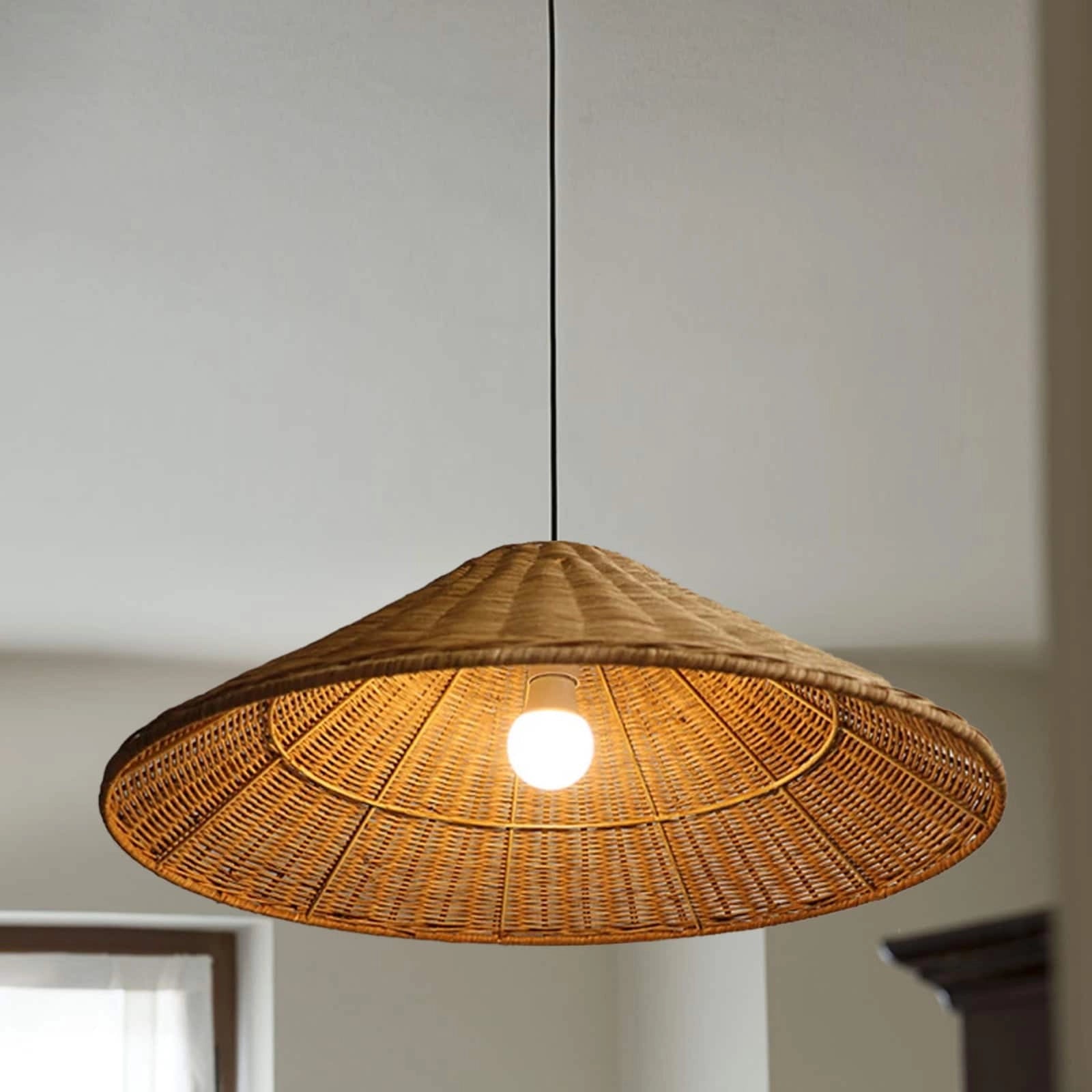 Woven rattan pendant light with a conical shape, eco-friendly design, and amber tones, suspended from the ceiling, perfect for Scandinavian decor, Braun color, D50CM.