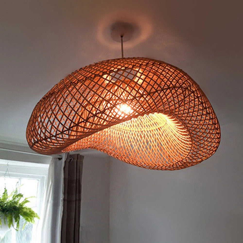 Woven rattan pendant light with an eco-friendly boho design hanging from the ceiling, featuring a 60cm diameter shade, emitting warm amber lighting.