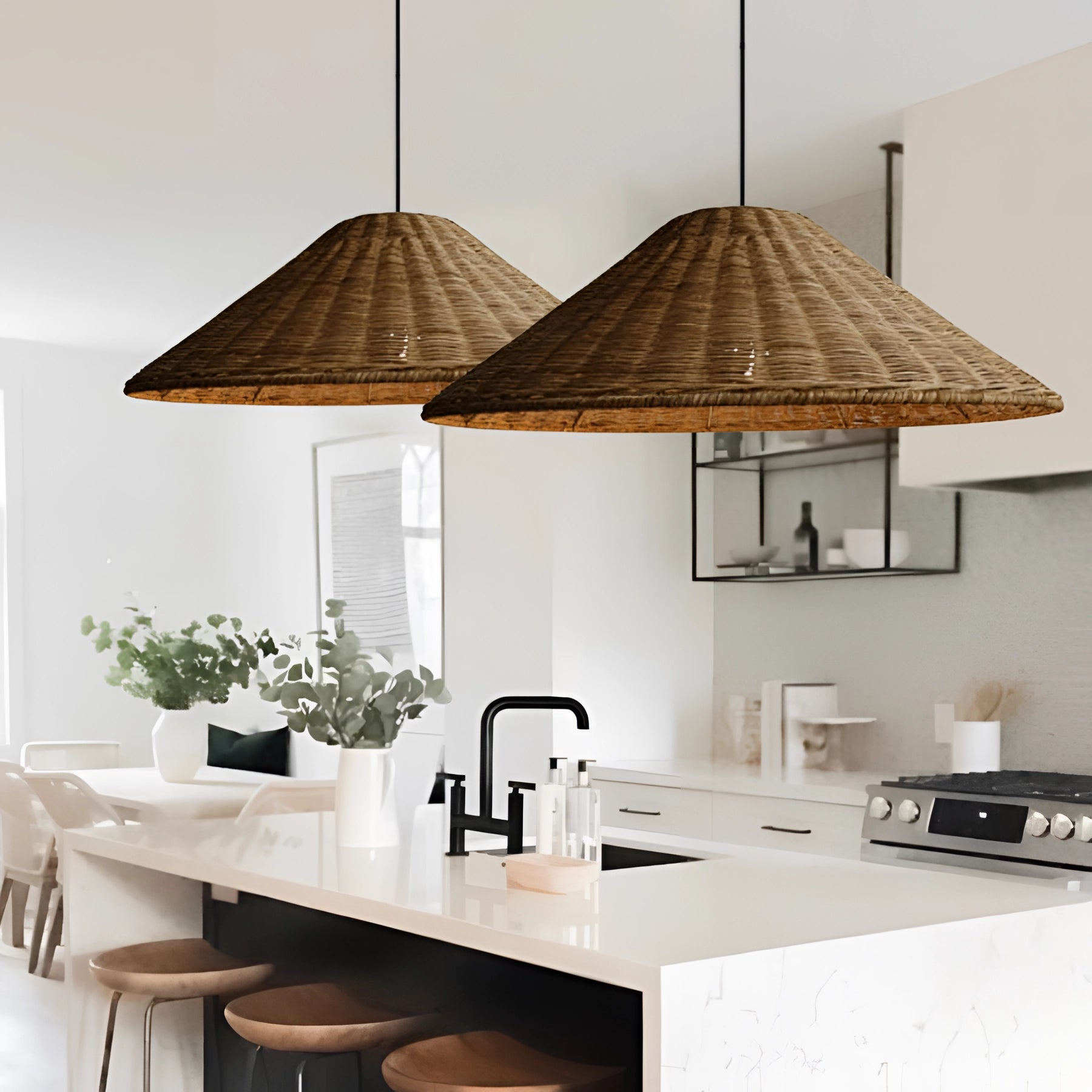 Woven rattan pendant light in a conical shape, hanging above a wooden countertop near a window, with plants in the background and fitting Scandinavian decor.