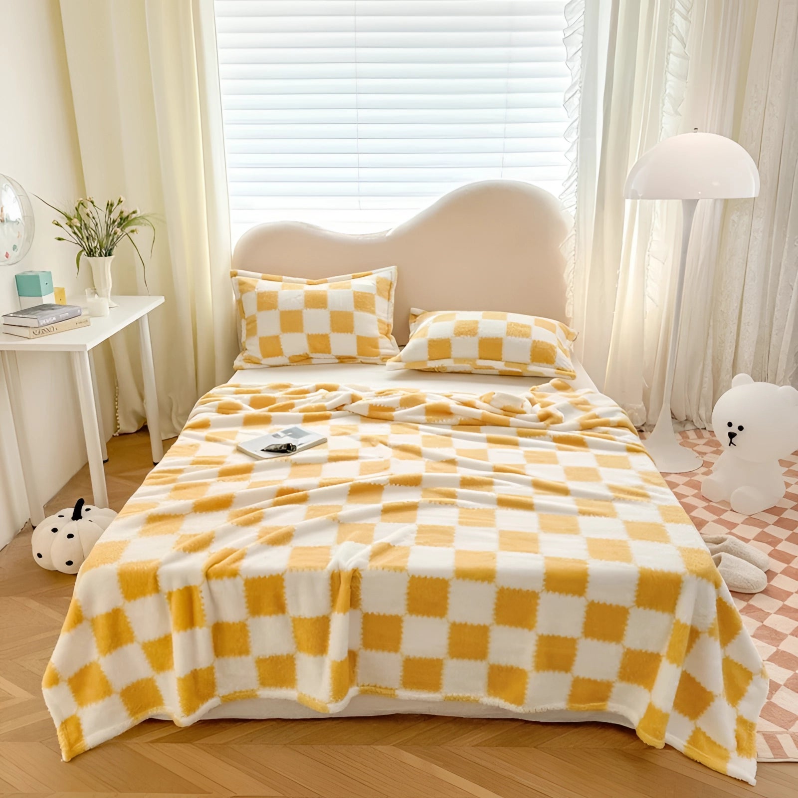 Yellow checkered bedding set featuring a gingham bedsheet and plaid duvet cover, displayed in a cozy bedroom with natural light streaming through a window, creating a comfortable and inviting atmosphere.