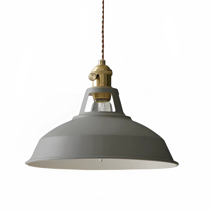A gray vintage dome pendant with brass accents, featuring an industrial design, hanging as a ceiling fixture.